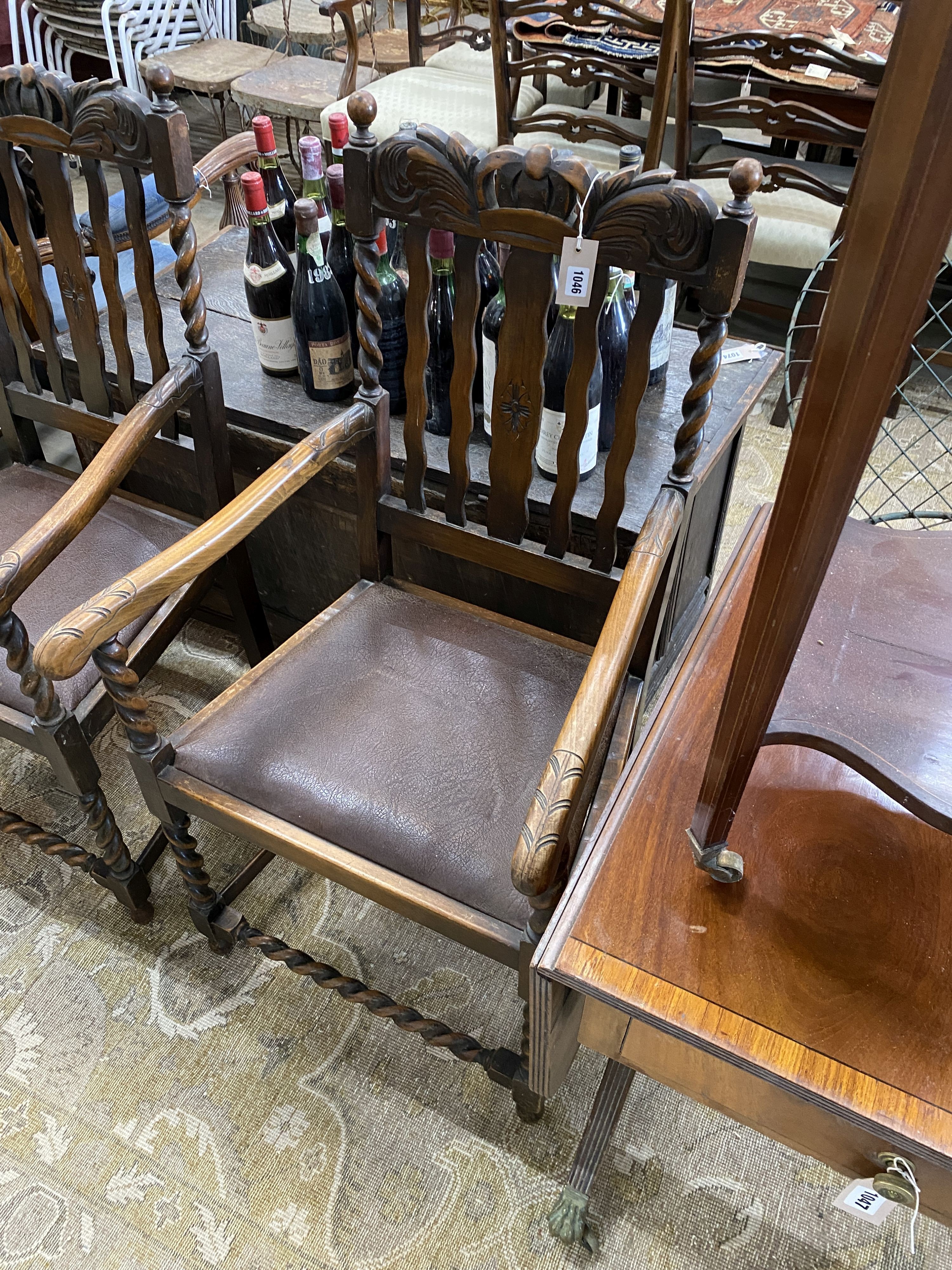A pair of 1930’s carved beech Carolean style elbow chairs